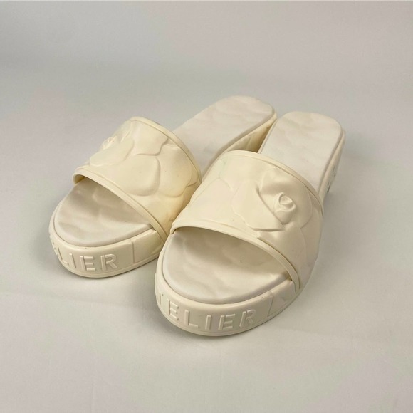 VALENTINO GARAVANI ATELIER SCULPTED PLATFORM POOLSIDE SLIDE  Valentino Garavani Platform Sculpted Poolside Mules in Avorio